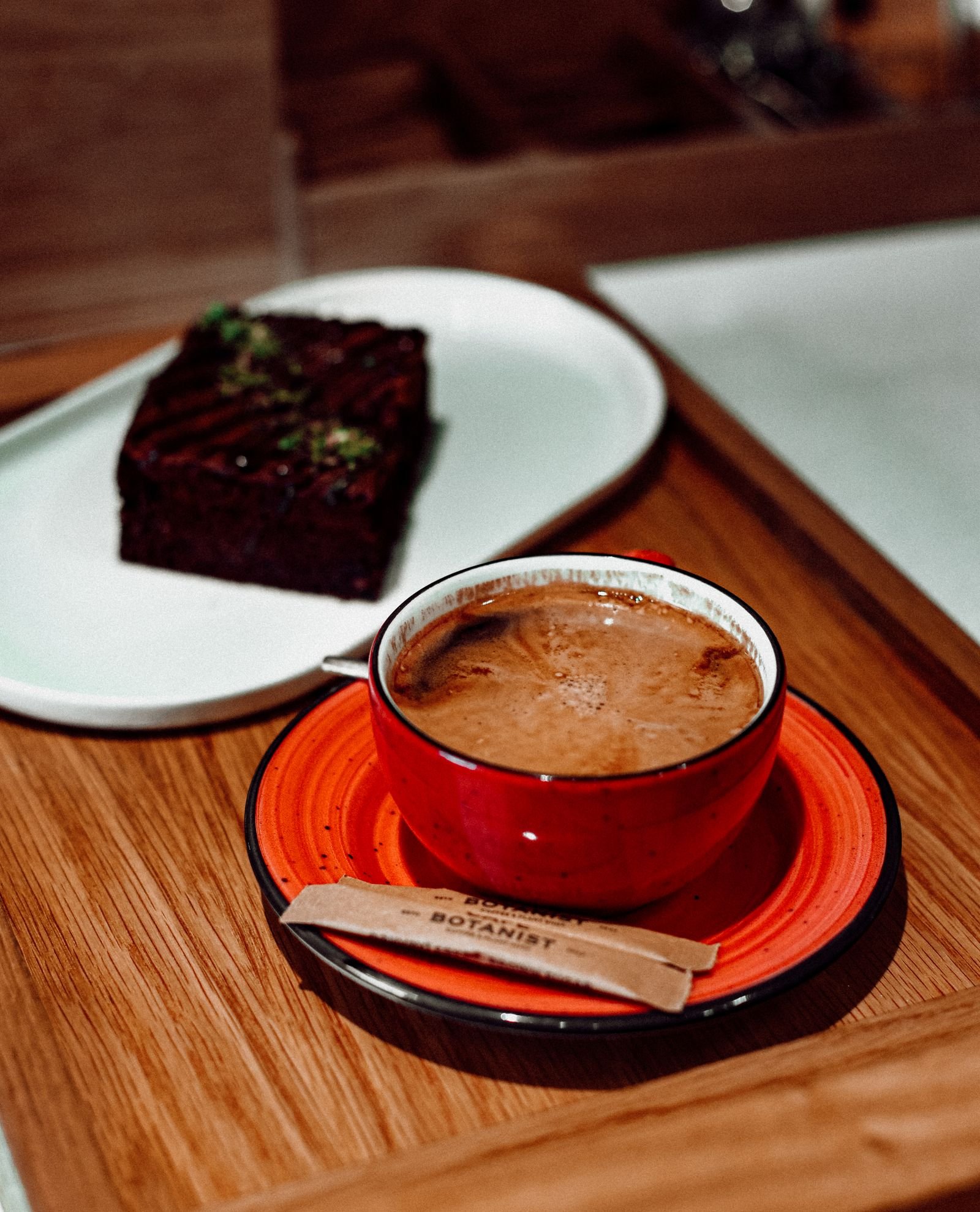 Coffee served with a slice of chocolate cake