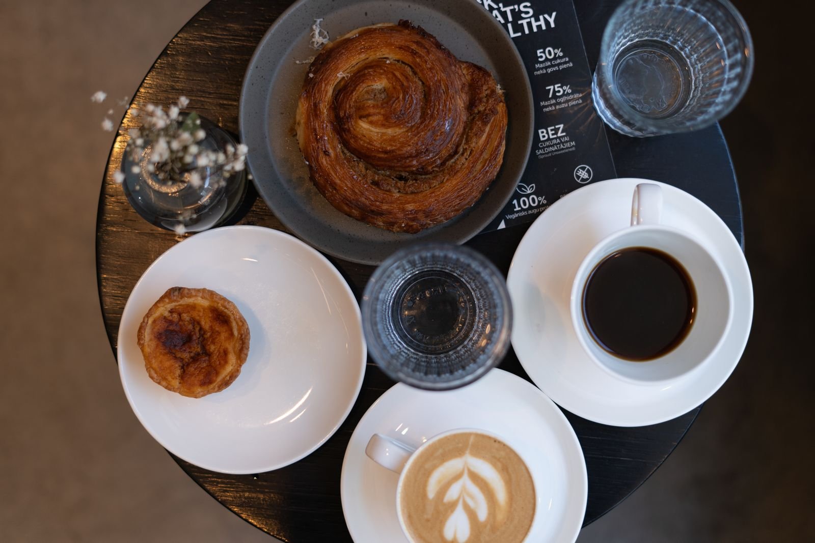 Coffee and pastries arranged on a cafe table